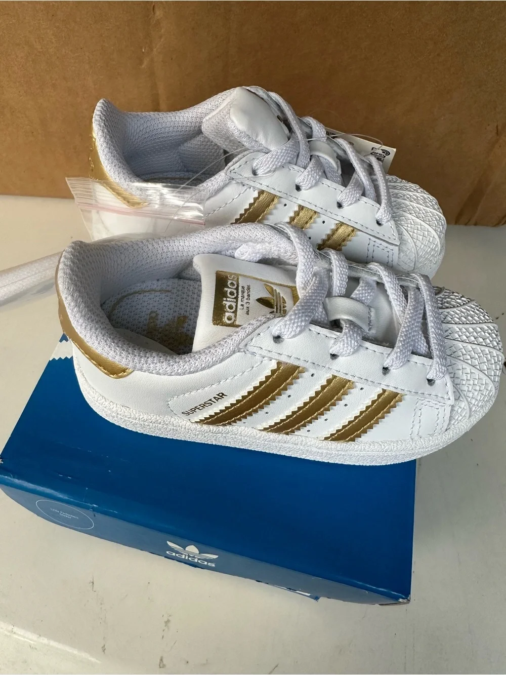 adidas Kids White Sneakers with Gold Stripes